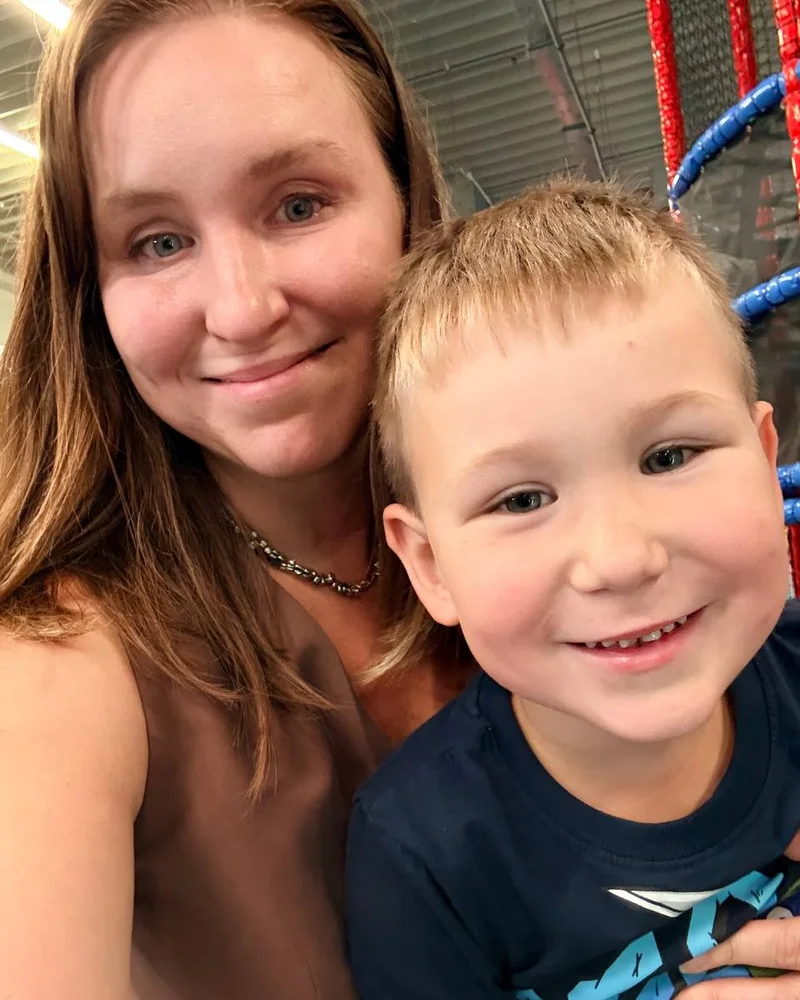 Nadya Tsech, who founded Booku, with her son